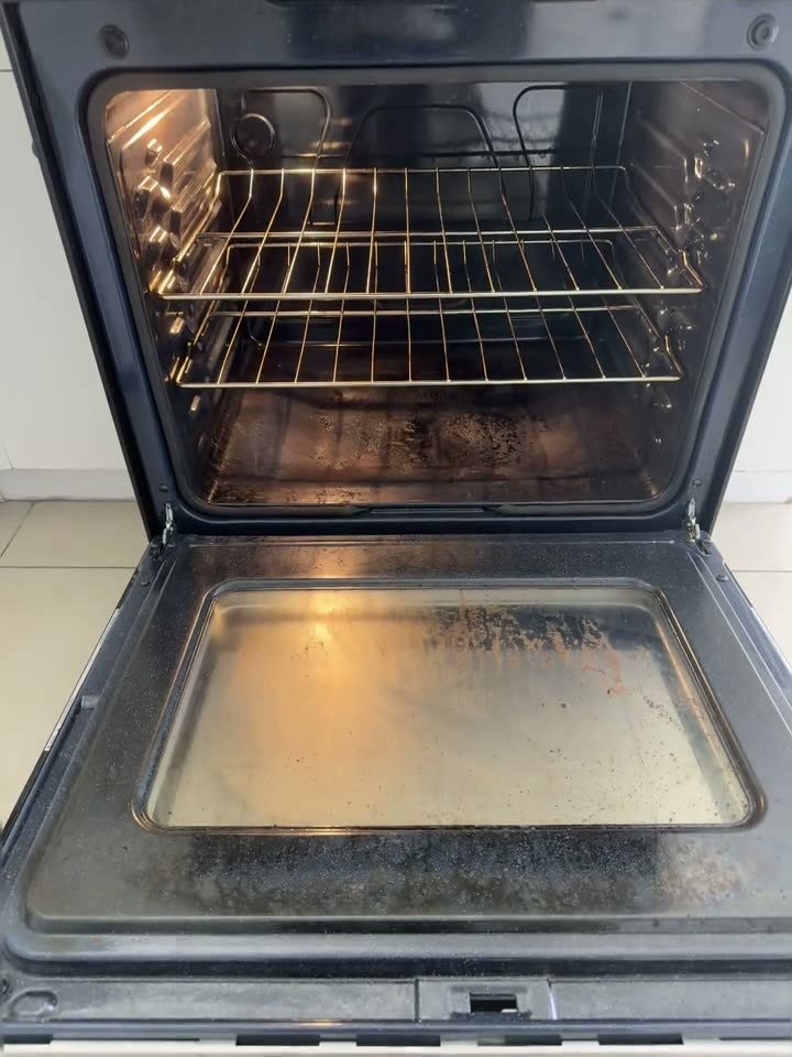 Oven being deep cleaned, racks and interior